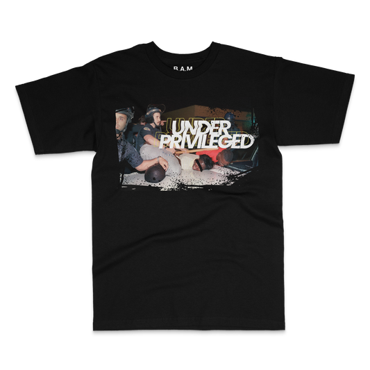 Black tee with photo of riot police pinning men to a car hood under Under Privileged lettering – BY ANY MEANS by 2ManyLookz